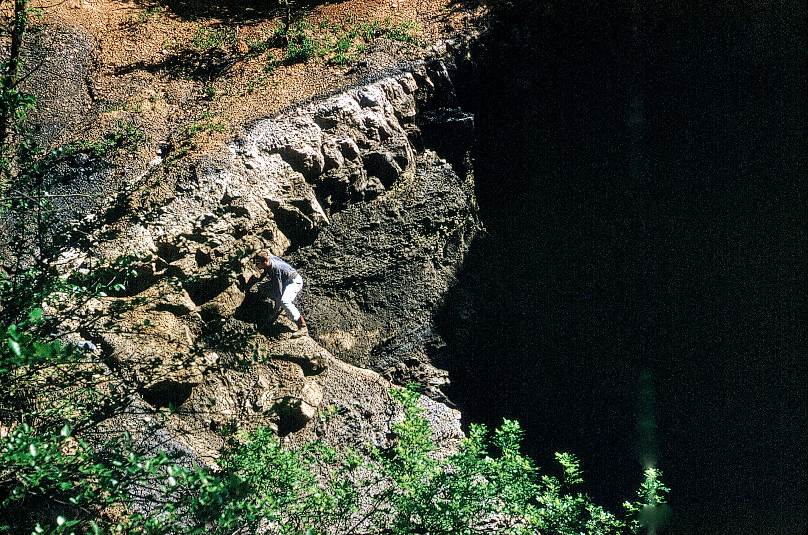 Sinkhole in coal-mined area near Weir, Cherokee County, 1962.
